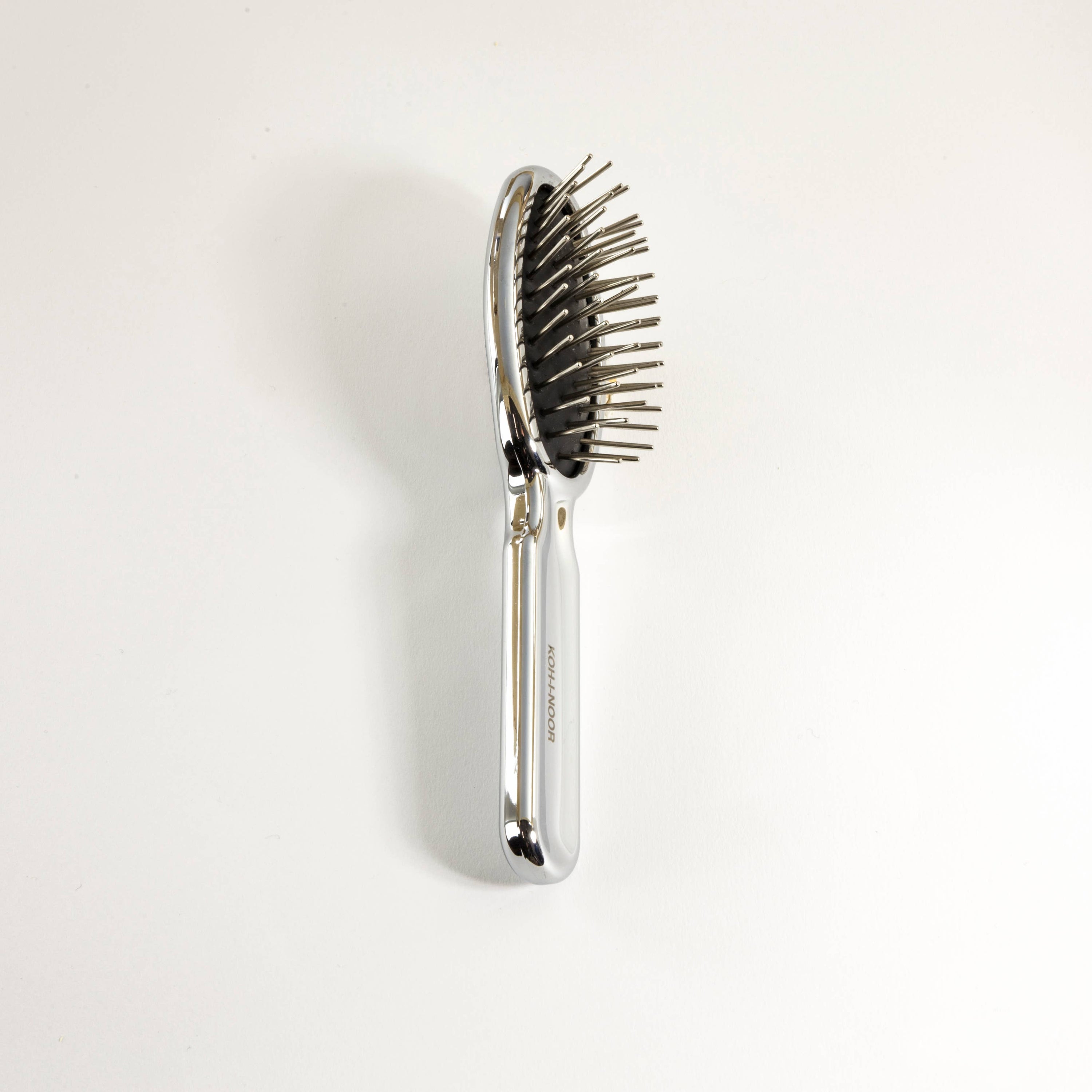 Brosse à cheveux pneumatique de luxe à effet or et argent