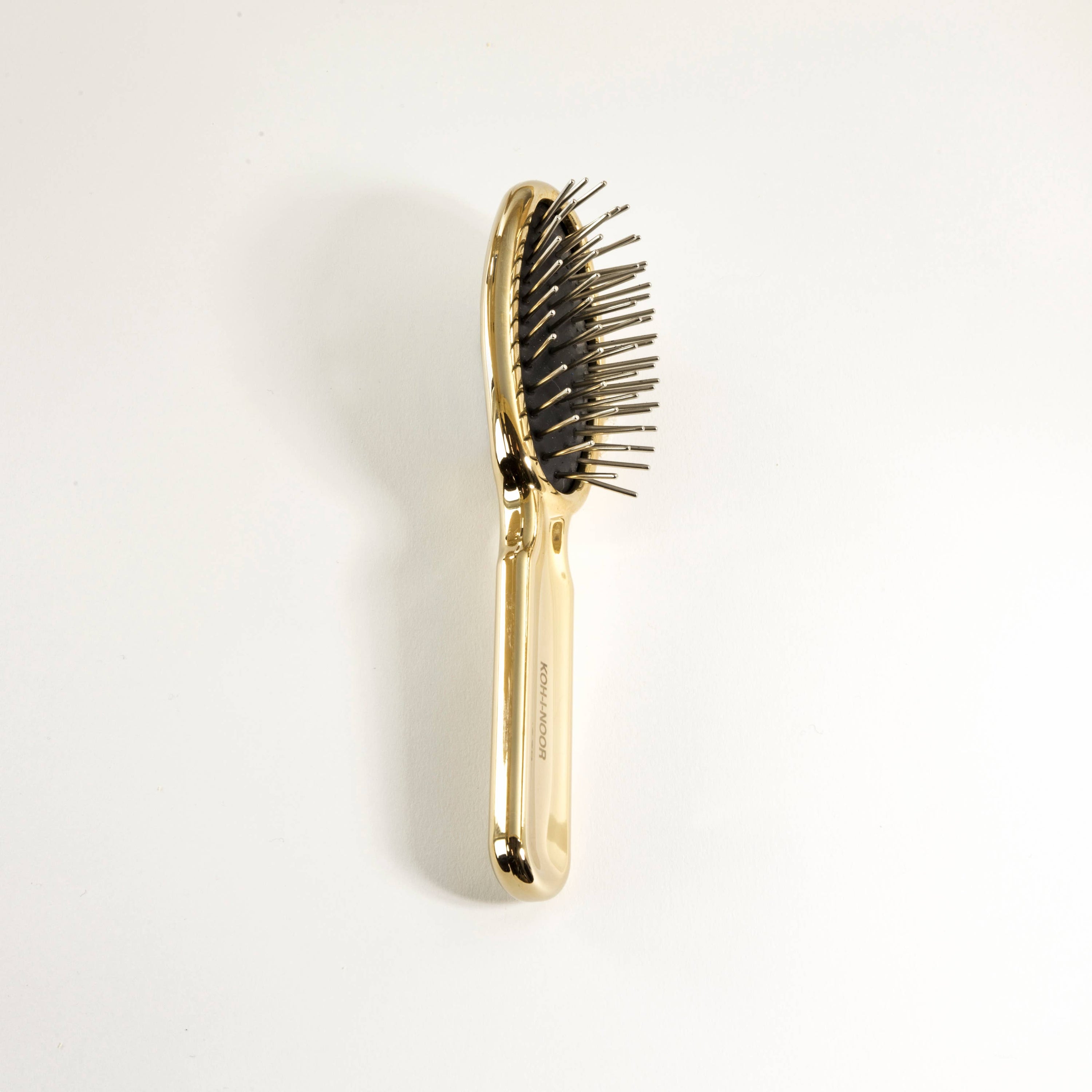 Brosse à cheveux pneumatique de luxe à effet or et argent