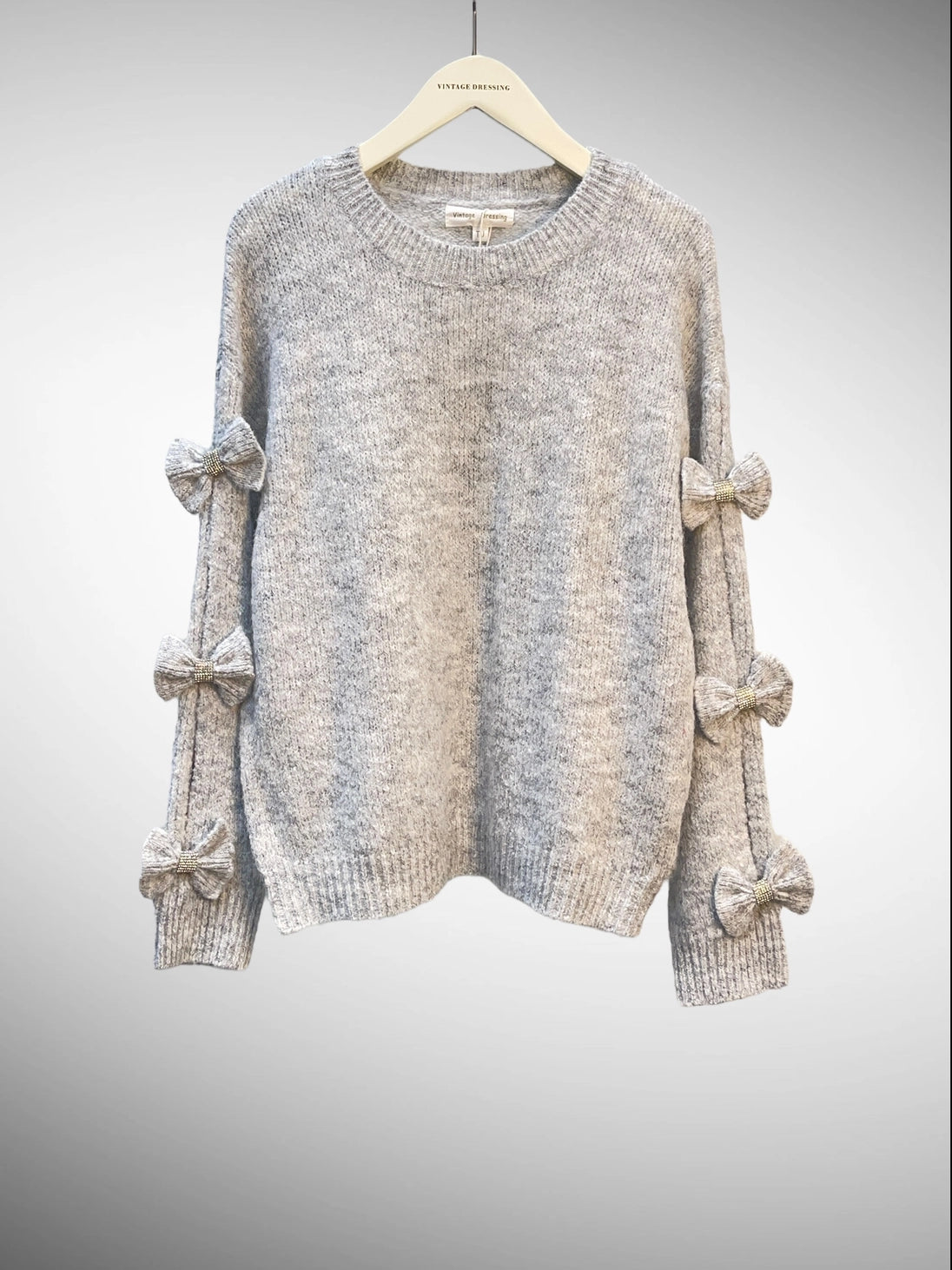 Pull en maille mélangée de laine avec nœuds et strass