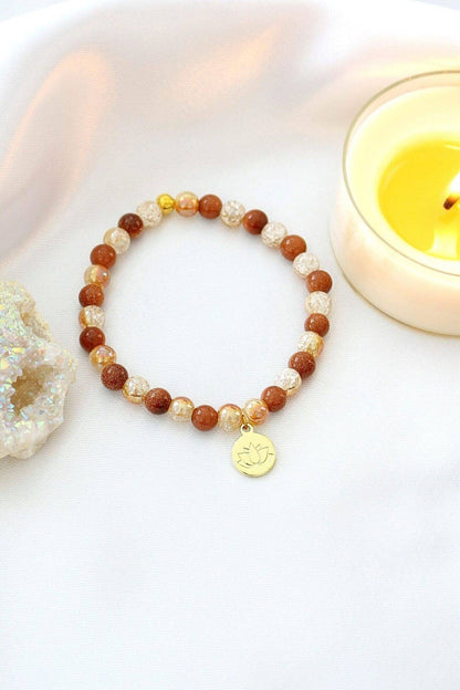 Goldstone Elastiskt Armband | 24 Karats Lotus Amulett